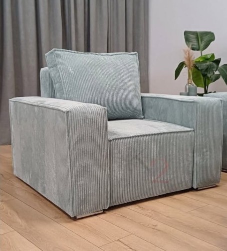 Fotel uszak tapicerowany w salonie